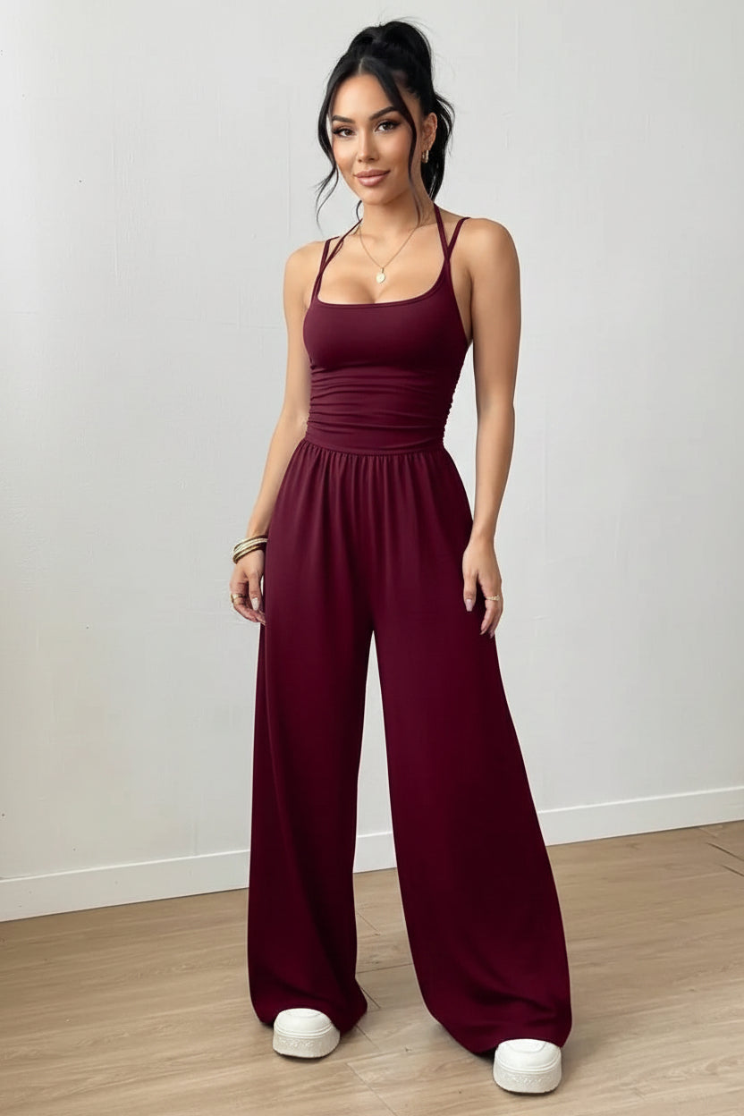 Dames Zwarte Jumpsuit – Geplooid Design met Halterhals en Wijde Pijpen