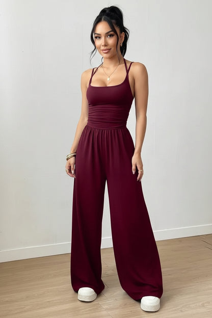 Dames Zwarte Jumpsuit – Geplooid Design met Halterhals en Wijde Pijpen