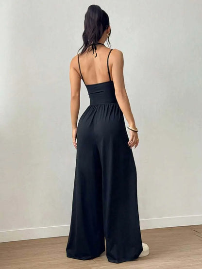 Dames Zwarte Jumpsuit – Geplooid Design met Halterhals en Wijde Pijpen