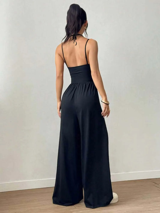 Dames Zwarte Jumpsuit – Geplooid Design met Halterhals en Wijde Pijpen